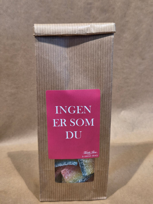 Syrlig regnbue med tekst: ingen er som du